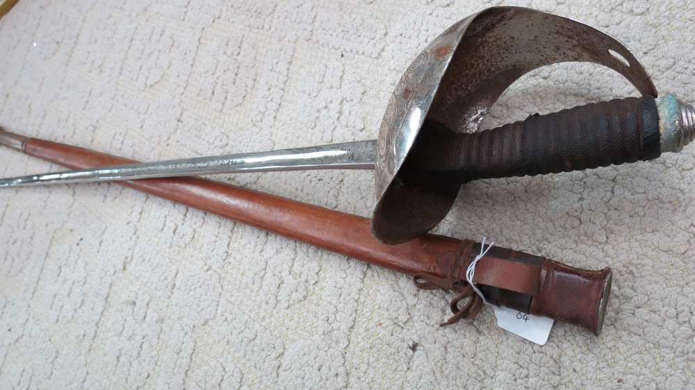 An 20thC British sword by Manton & Co. England, with etched blade and engraved hilt in a leather