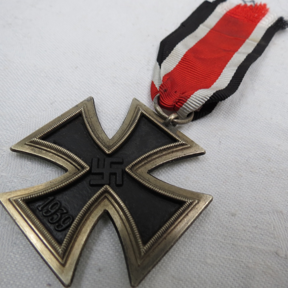 A Nazi Iron Cross, Second Class on ribbon.