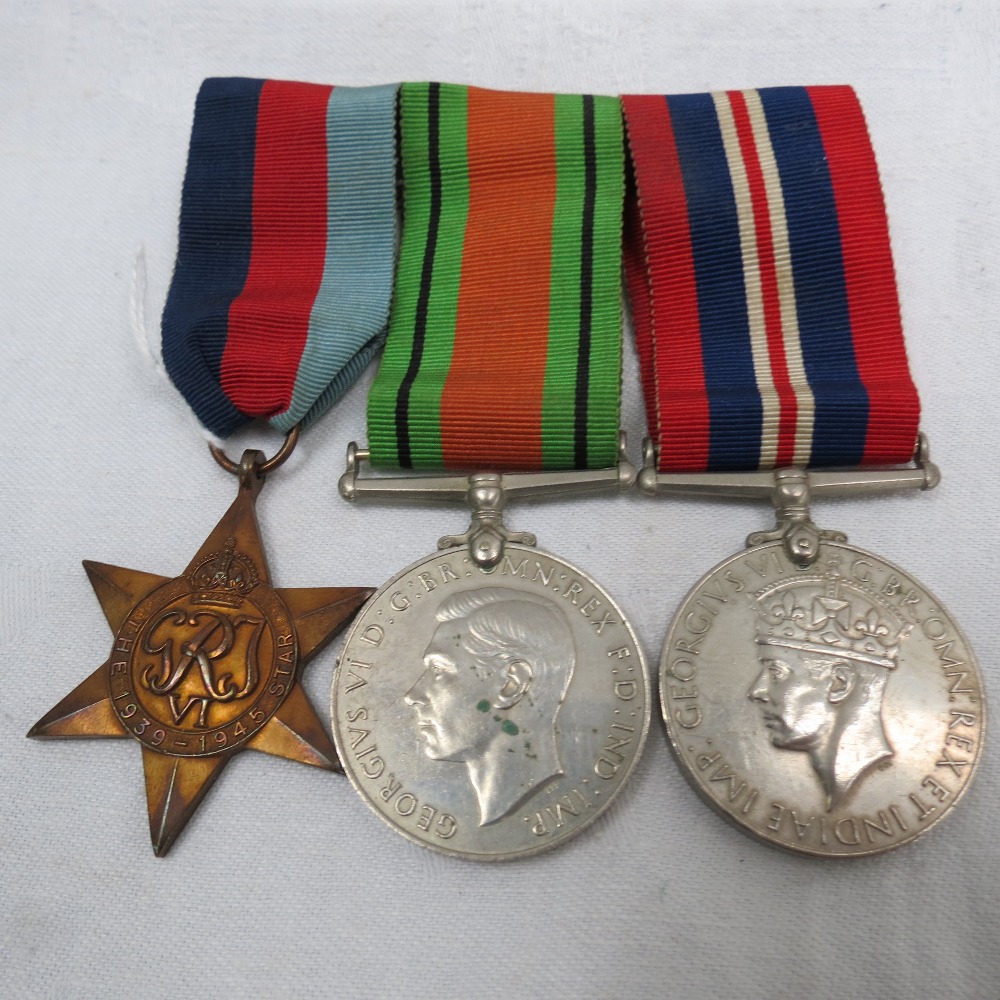 World War II medals awarded to Robert Nixon: 1939-1945 Star, Defence Medal and War Medal, mounted