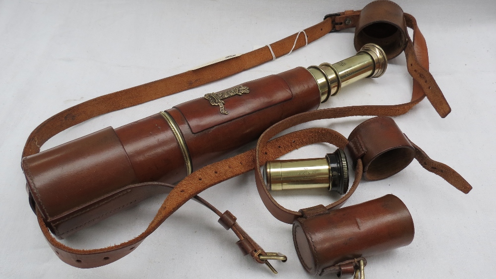 A Signals Regiment brass and leather three draw telescope with sun shade and extra eye piece for '