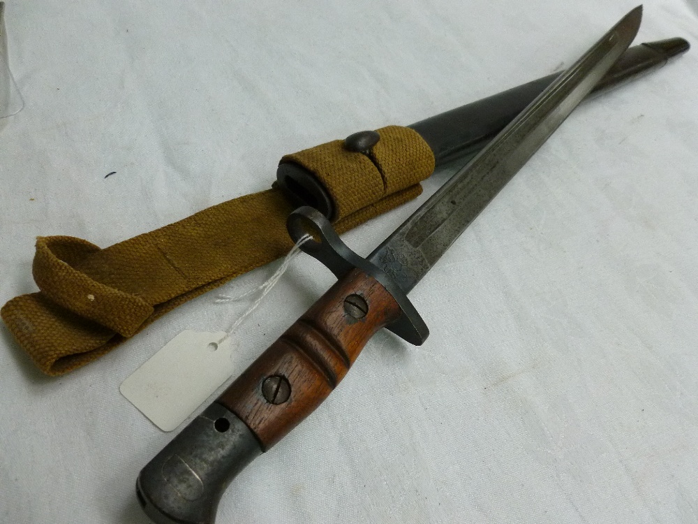 A WW-I United States Remington bayonet, leather scabbard and frog, date stamped 1917. Blade length