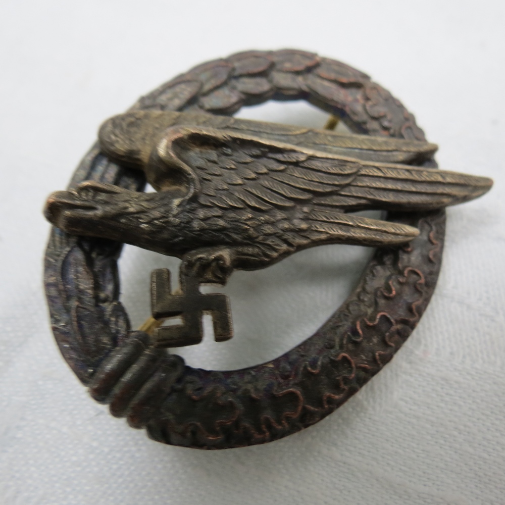 A Nazi Army Para badge, oval cast with eagle clutching swastika.