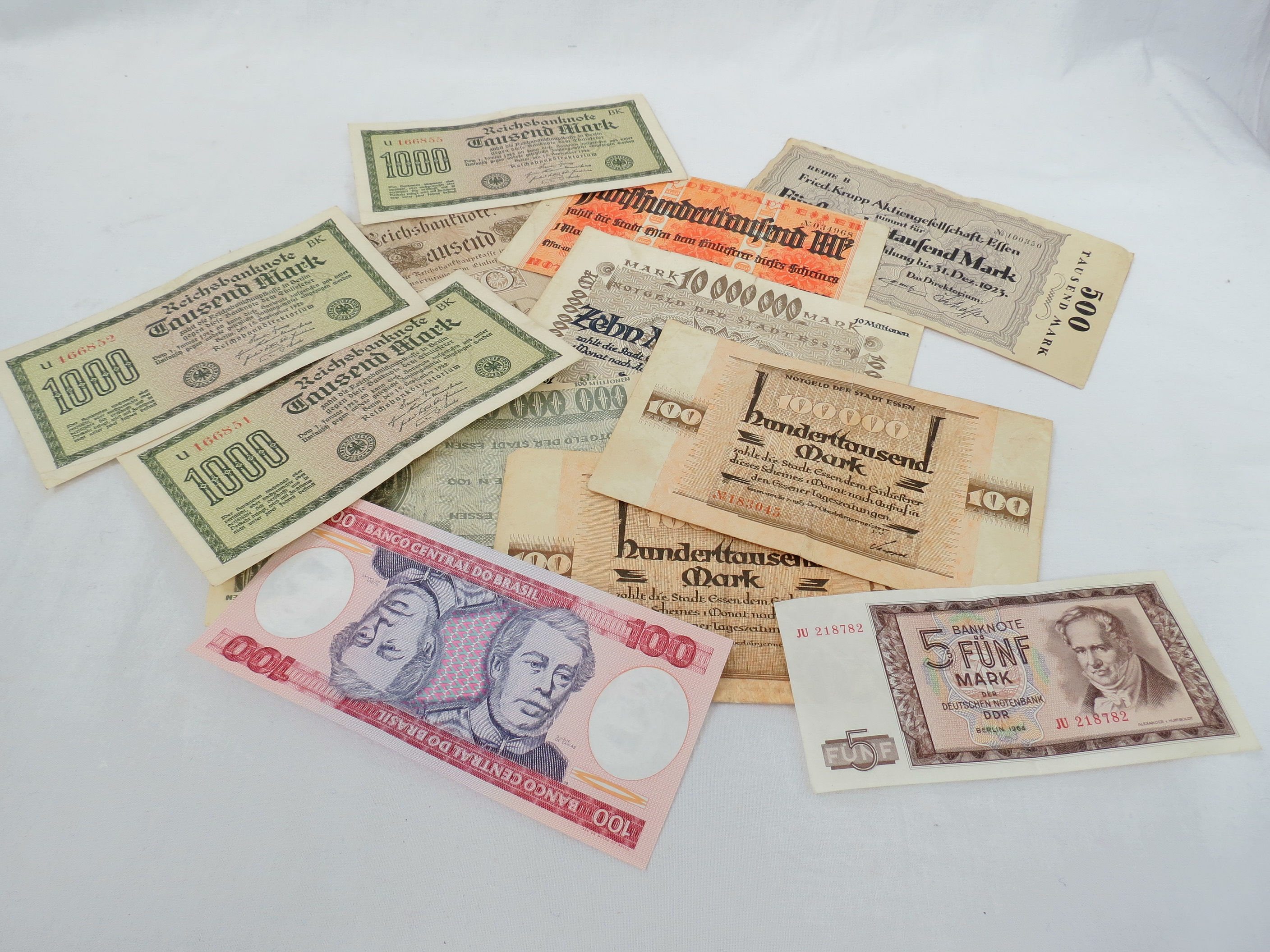 A quantity of 20thC banknotes including German 100,000,000 Marks, and other hyper inflation notes,