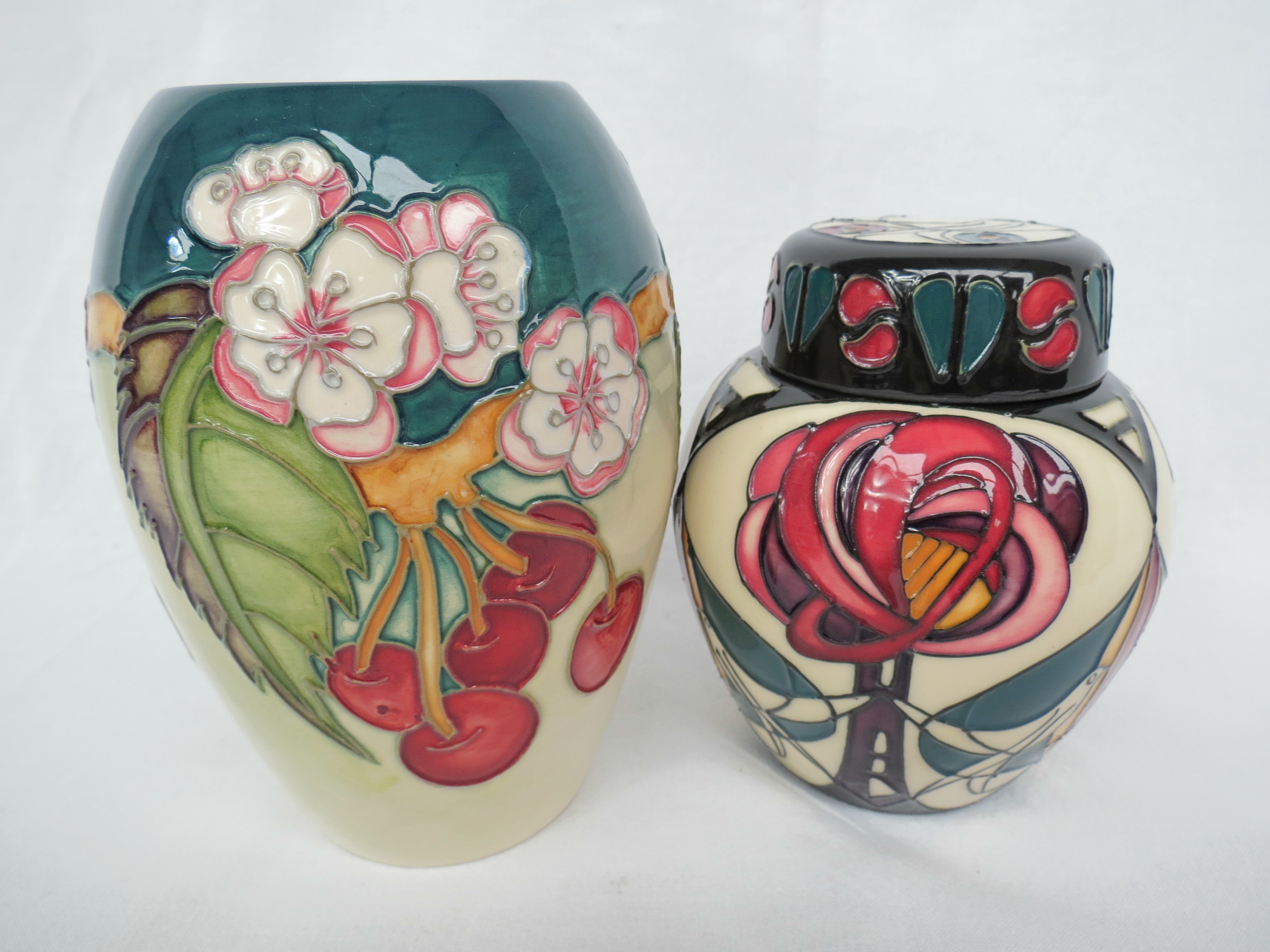 A Moorcroft vase of short ovoid form decorated with flowering cherry, 14cm high.