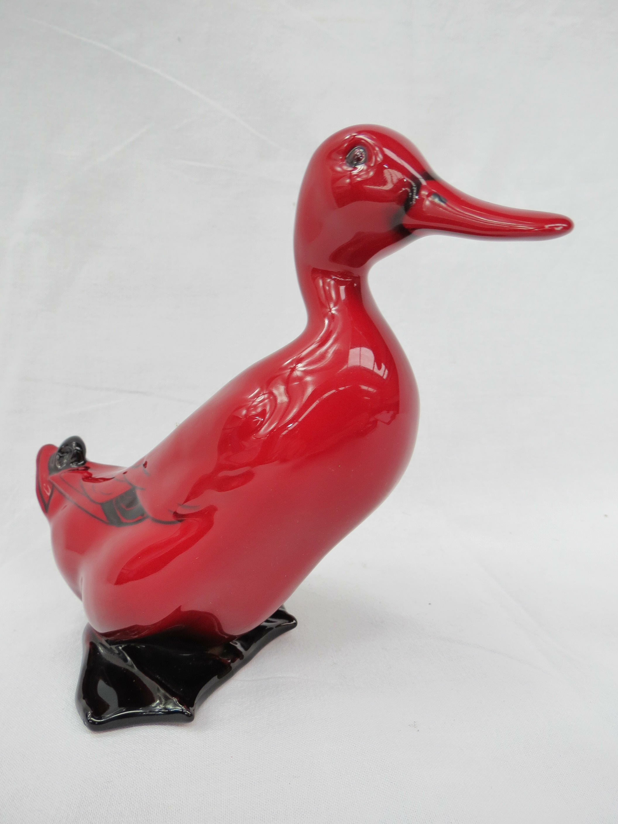 A Royal Doulton flambe model (no HN2647) of a duck. 14cm high.