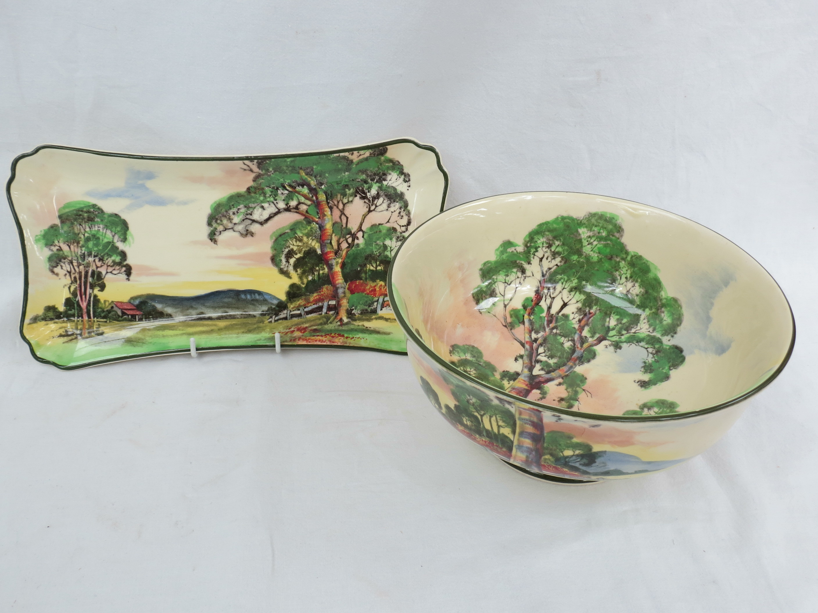 A Royal Doulton bowl decorated with a farmstead in a landscape, 22cm dia, together with a