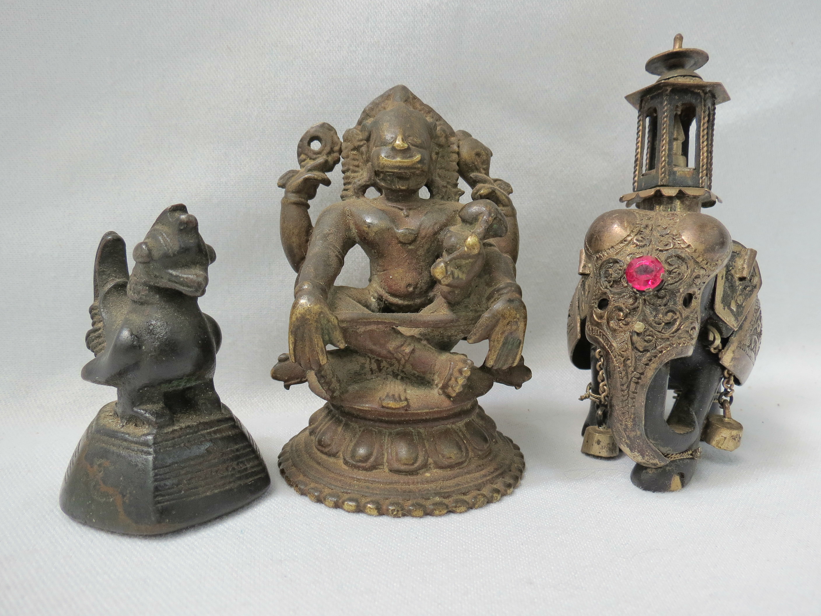 A small Hindu brass votive figure of a four-armed god, possibly Vishnu, also a bronze cockerill