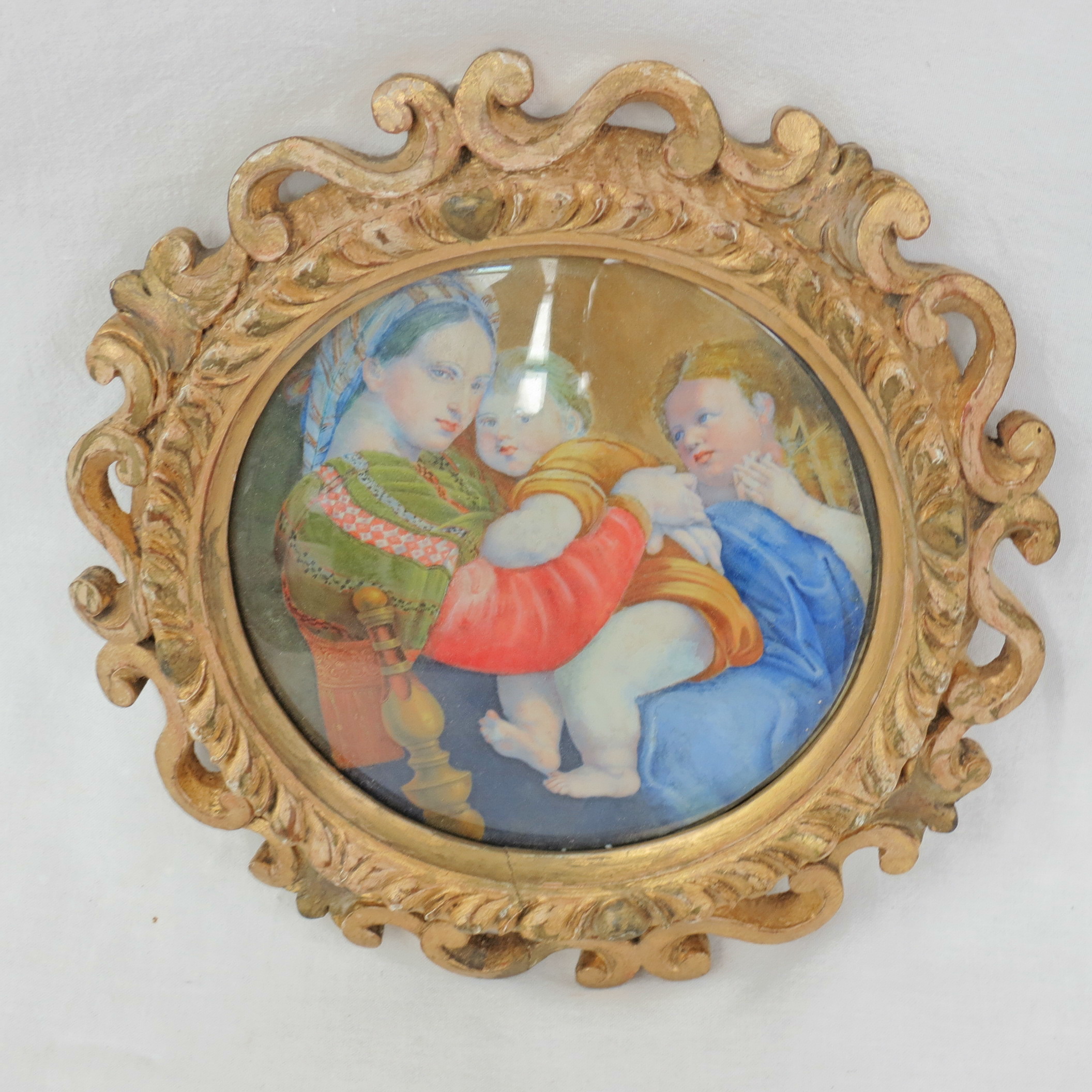 After Raphael, Madonna della Sedia, watercolour on ivory in a carved gilt frame, 14cm tondo.