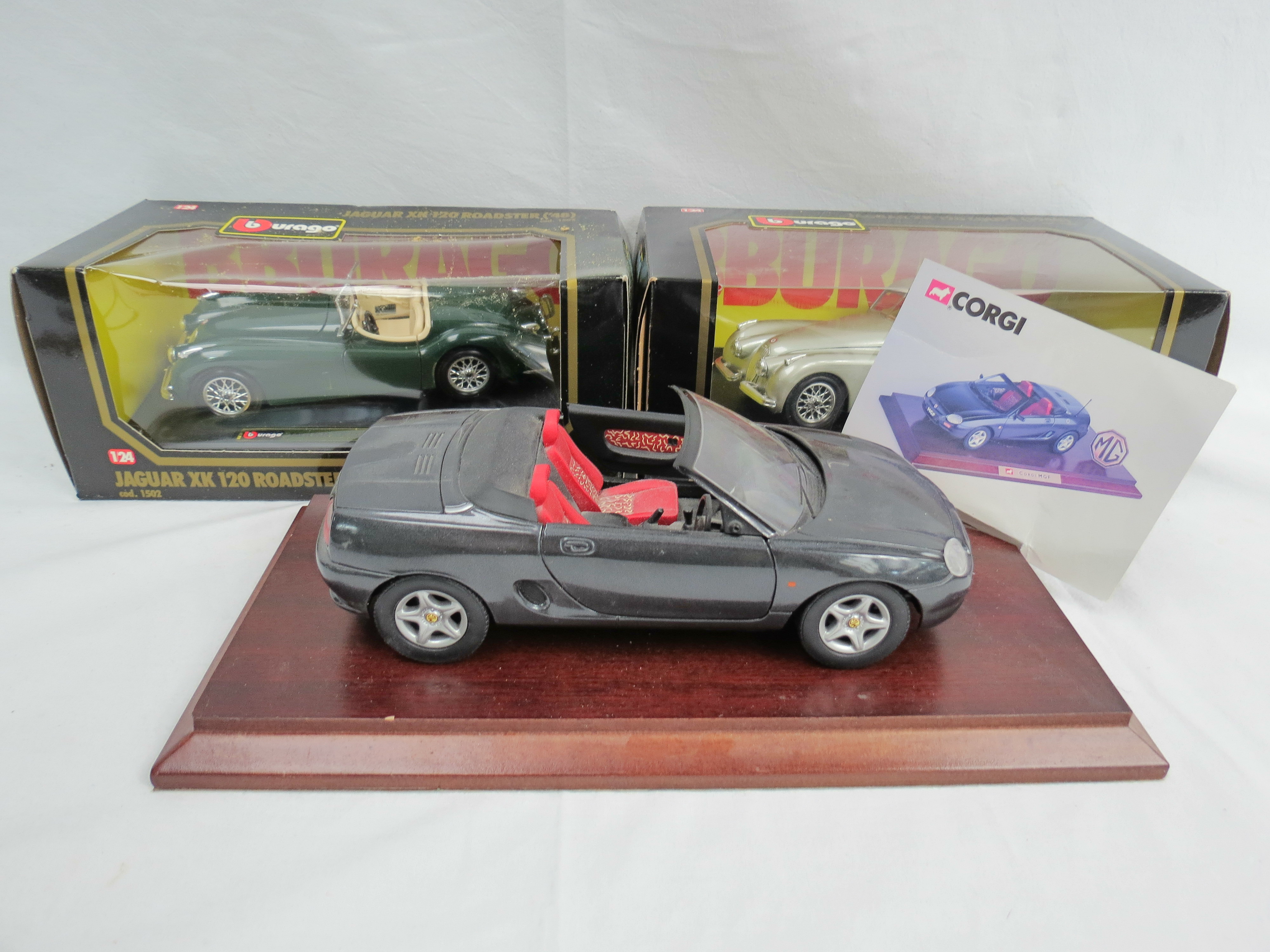 A Corgi 1:18 scale die-cast limited edition model of MG MGF on a wooden base together with two