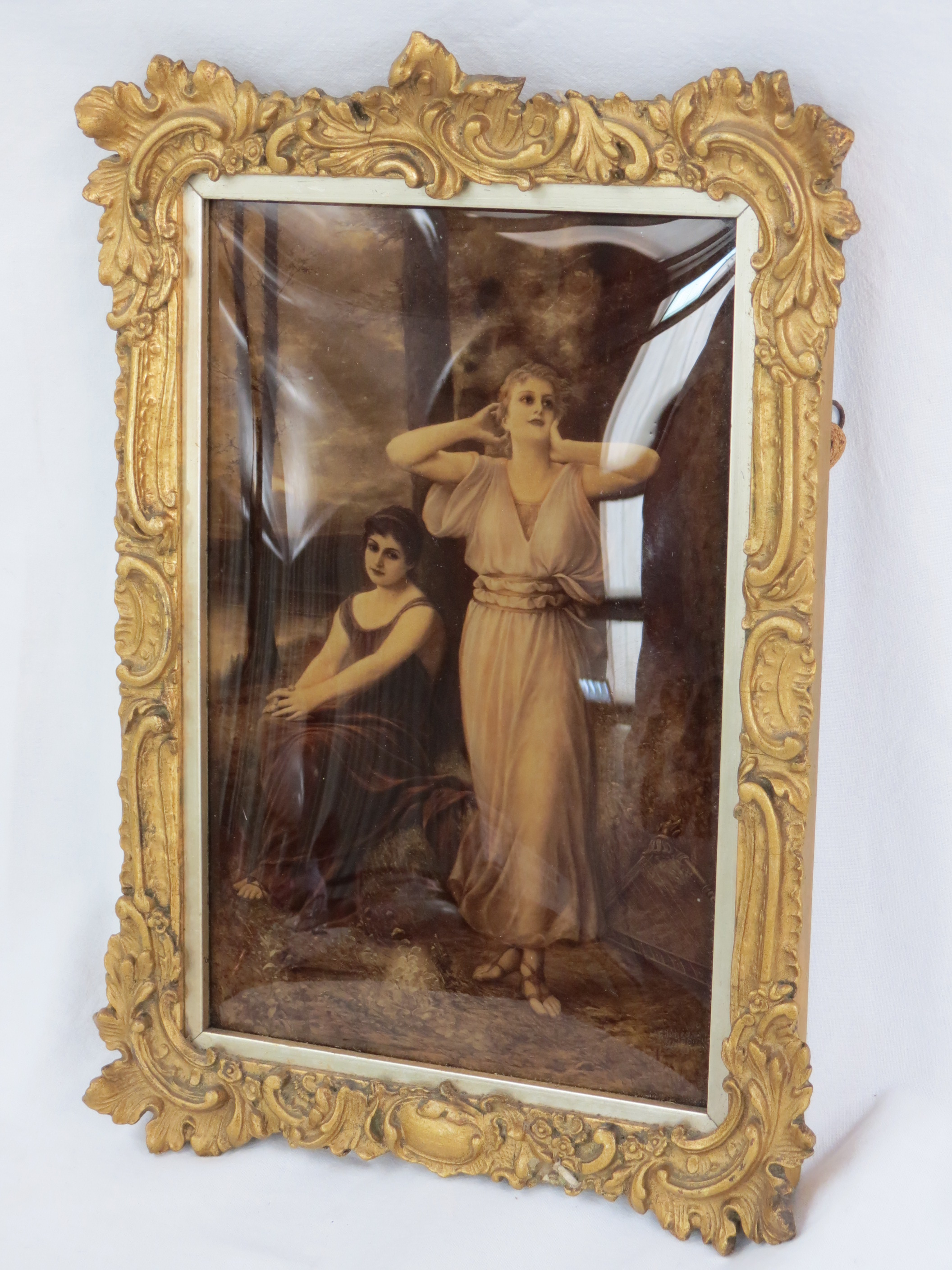 An early 20thC Crystolium, depicting two ladies beside a lake one with a harp at her feet, measuring