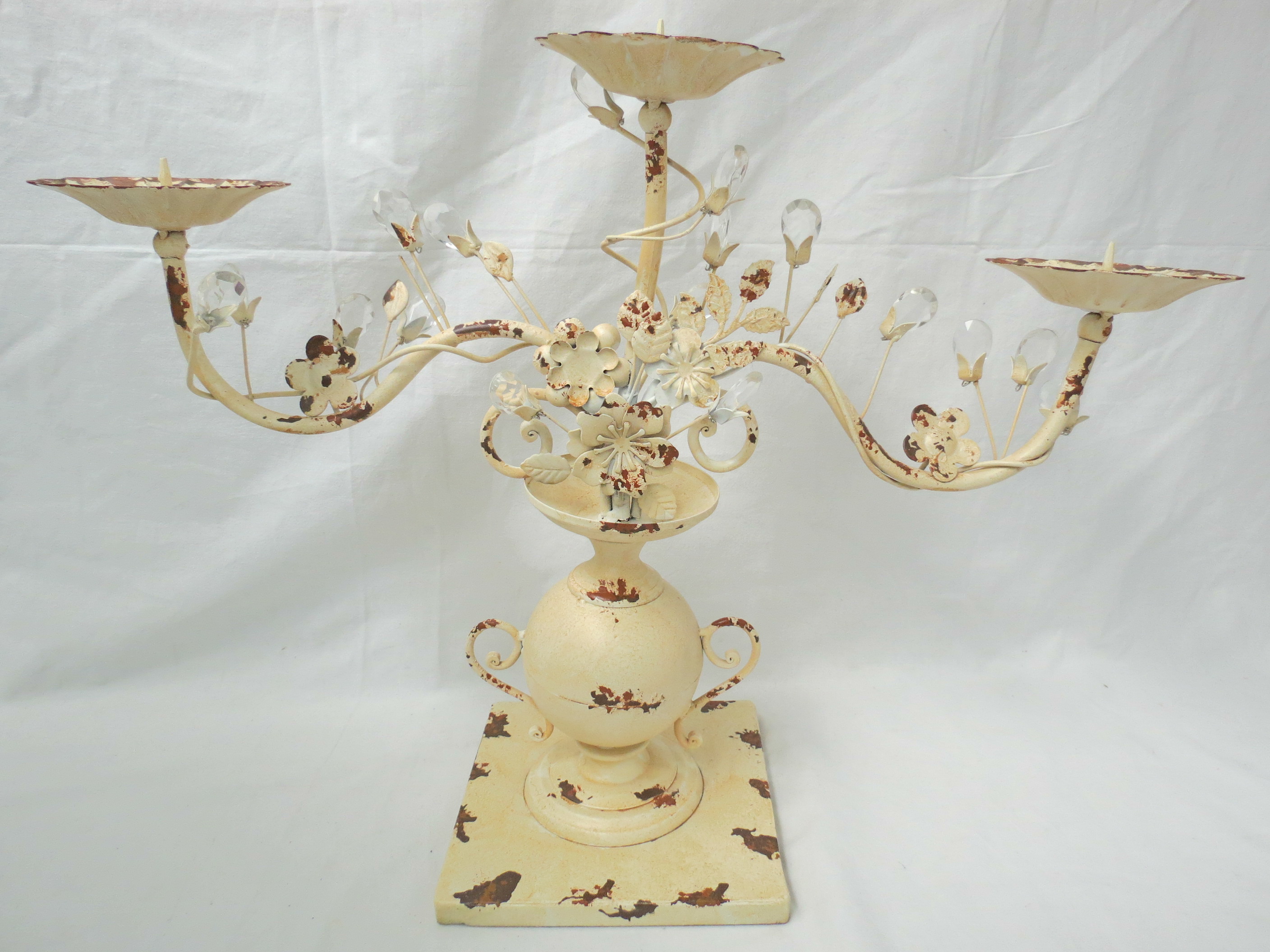 Three light tole candelabrum in the form of an urn topped with crystal set foliage, measuring 42cm