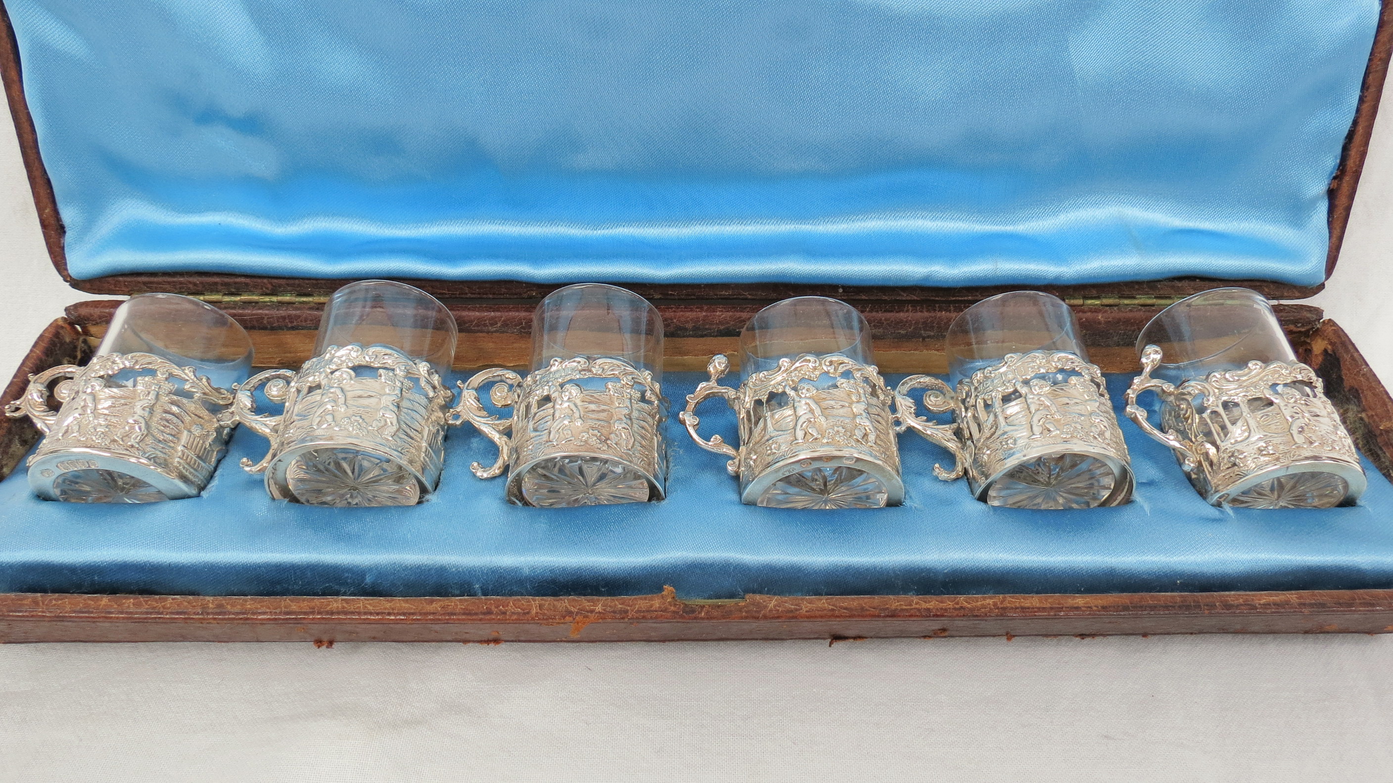 A boxed harlequin set of six silver mounted and cut glass liqueur glasses, Birmingham and London