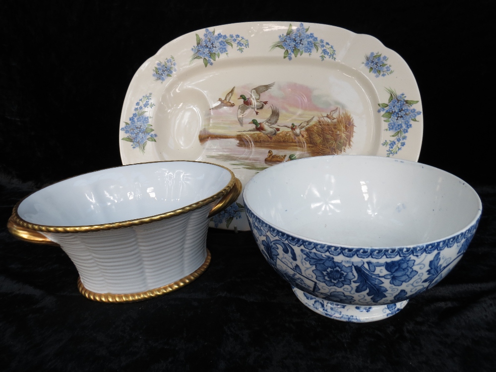 A large meat dish decorated with ducks, a blue and white punch bowl iin Tokio design by Royal Bonn
