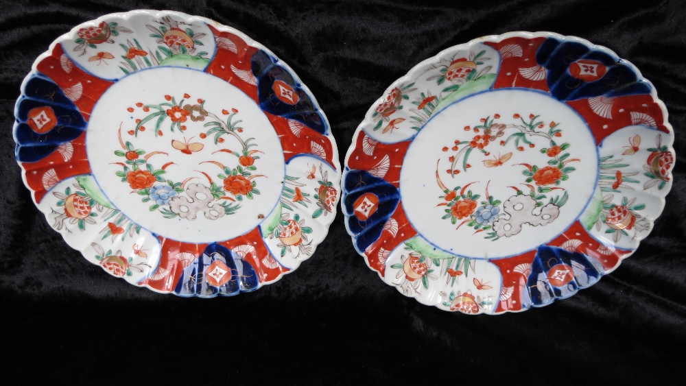 Two fluted Oriental Imari plates.