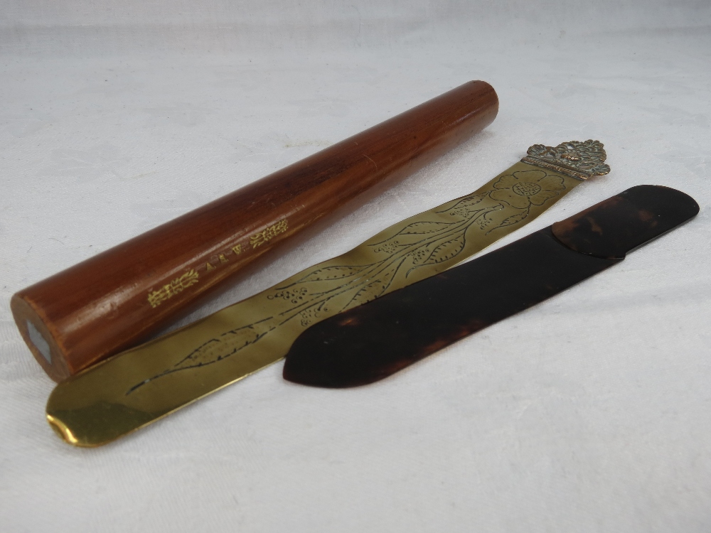 A tortoiseshell paper knife, copper paper knife with angel faced finial and a giant pencil marked