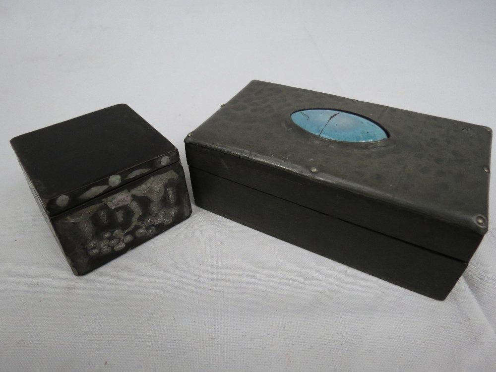 An arts and crafts pewter covered box with ceramic cabochon and small wooden box inlaid with