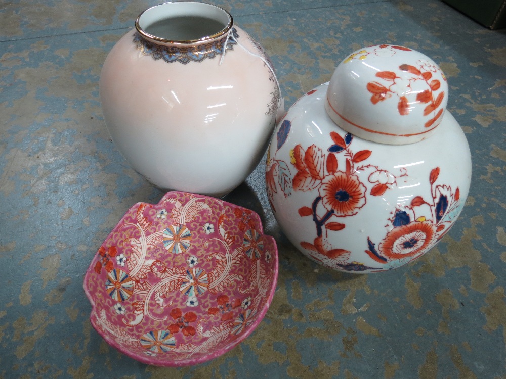 An ovoid Satsuma vase with flower and butterfly decoration, an Oriental lidded ginger jar with