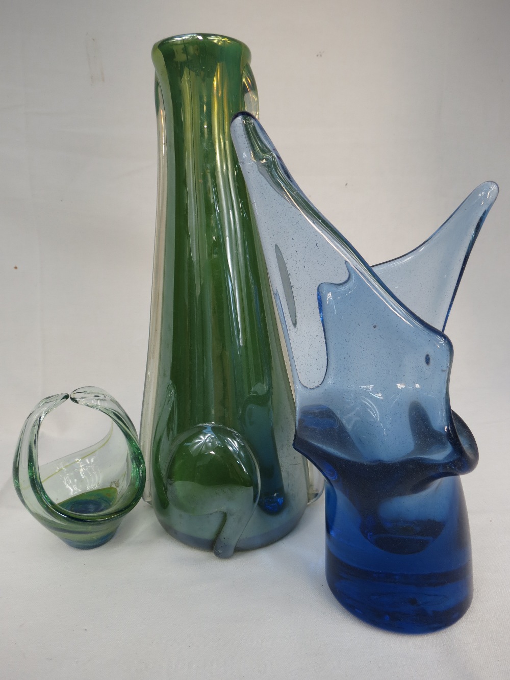 A studio glassware vase iin semi-opaque green, 12", a blue vase of abstract shape, 10" and a green