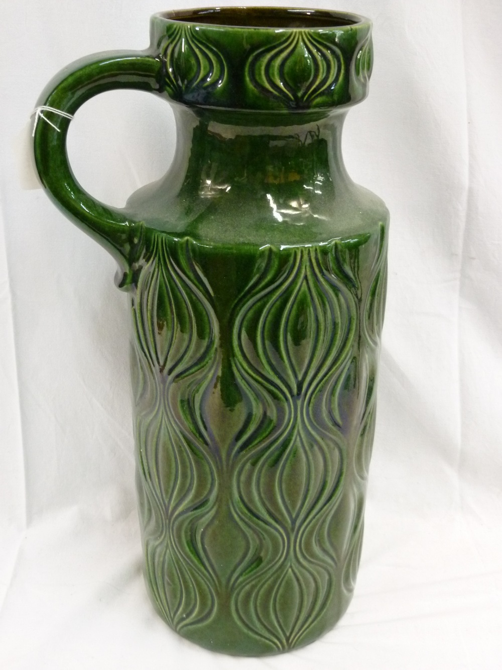 A large handled vase in green glaze with indented decoration marked beneath 485-45 W. Germany. 18"