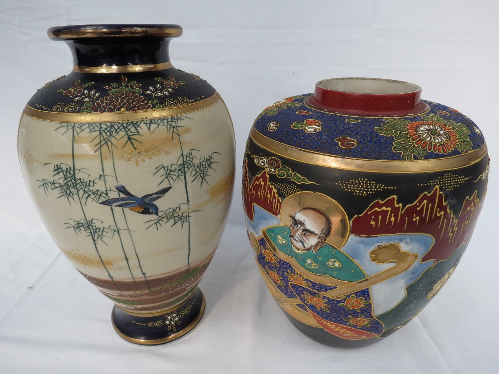 A Japanese satsuma vase decorated with a warrior and a bird flying through bamboo, 12" high.  Also