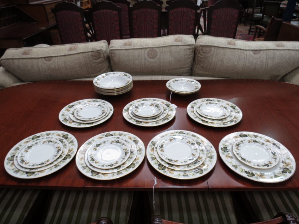 A partial dinner service of Royal Doulton `Larchmont` design (TC1019) comprising seven dinner