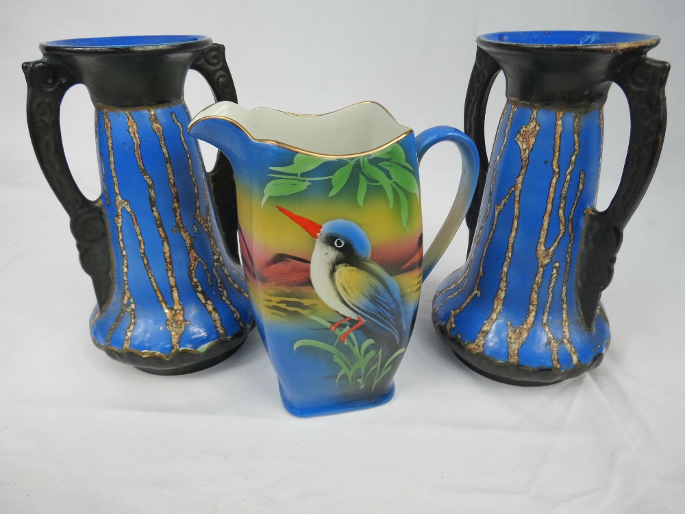A Rubian art deco jug with bird decoration, also a pair of art deco twin handled vases.