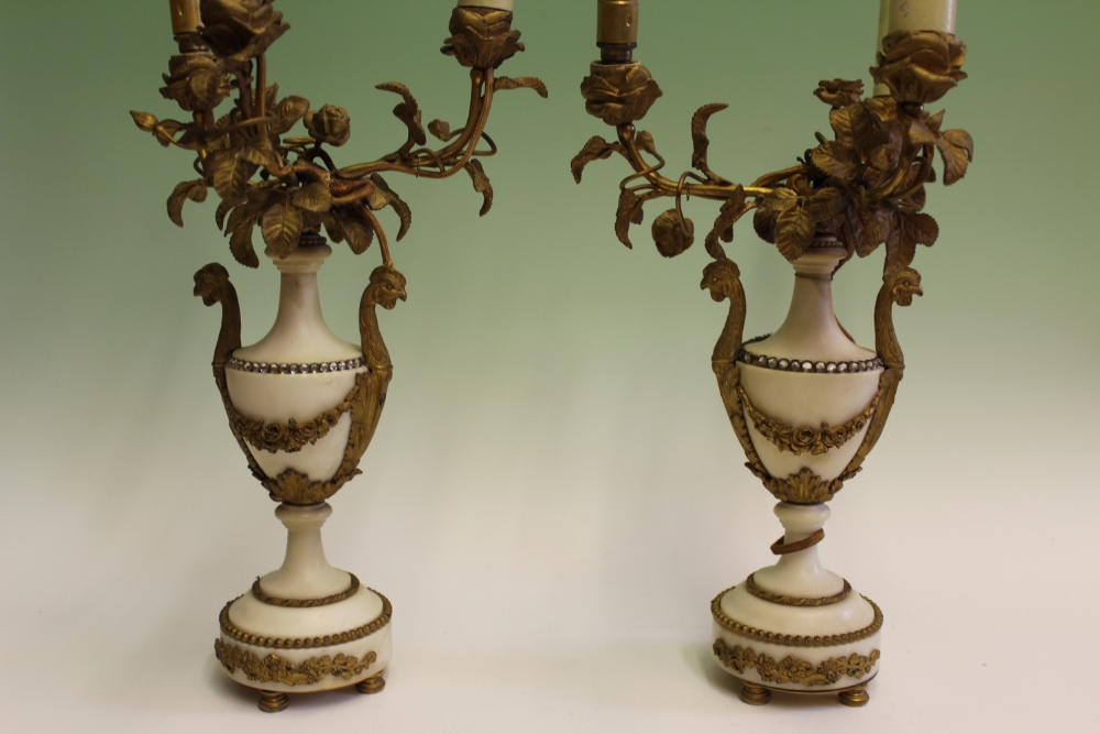 A pair of late Victorian/Edwardian gilt brass and marble candelabra, the marble bodies of urn