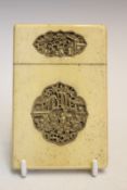 A 19th Century Chinese export ivory card case, carved in relief with panels of figures and