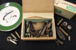 A box of powder flask and shot bag parts, together with three Wood & Son ceramic plates decorated