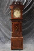 An early 19th Century mahogany cased eight day longcase clock, with painted 14 inch arched dial,