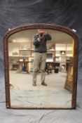 A large Victorian arch top overmantel mirror, in gilt gesso frame, 110 x 130cm.