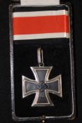 A cased jeweller’s copy of a Knights Cross, complete with ribbon.