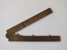 An 18th Centruy French gunner’s caliper, two-piece brass construction, engraved Les Parlies Egalles,