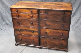 A 19th Century rosewood side cabinet, fitted with a bank of five graduated drawers and cupboard,