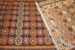 A tribal Kelim runner and another similar rug, the largest 344 x 135cm. (2)