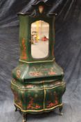 An interesting Italianate bureau cabinet with Chinoiserie decoration on a green ground, the shaped
