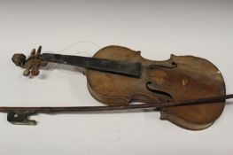 A violin, with two piece back, unsigned, length of back 37.5cm, together with a cello bow. (2)