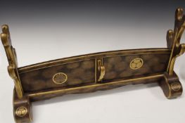 A fine quality Japanese lacquered sword stand, the black lacquered ground over decorated with gold