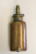 A copper three-way powder flask, the base with two swivel covers for cap and ball, brass top with