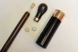 A novelty spirit flask walking stick, the threaded pommel revealing two thimble sized beakers and