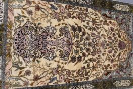 An Oriental silk prayer rug of Kashan design, 156 x 93cm.