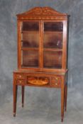 A 19th Century mahogany and satinwood inlaid and strung cabinet on stand, the upper section with a