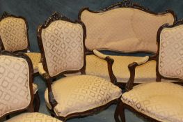 A late 19th Century Continental salon suite in Louis XV style, comprising settee, 127cm wide, a pair