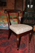 Attributed to Gillows: a pair of Regency rosewood side chairs, each with carved scroll bar back,