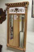 A Regency gilt framed pier mirror, with ball cornice and bevel edge plate beneath reverse