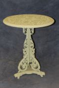 A Victorian cast iron conservatory table, later painted, with circular pierced top on centre