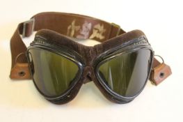 A pair of Second War period Japanese flying goggles, alloy frames stamped MAN, fitted with green