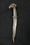 A Khanjar, 12.5cm wavy blade, one-piece iron hilt with ram’s head pommel and decorated profusely