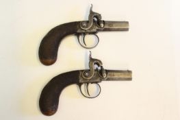 A good pair of percussion travelling pistols by Cogswell, 1.25 inch sighted octagonal turn-off