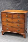 An early 19th Century mahogany and rosewood crossbanded bachelor’s chest, with brushing slide